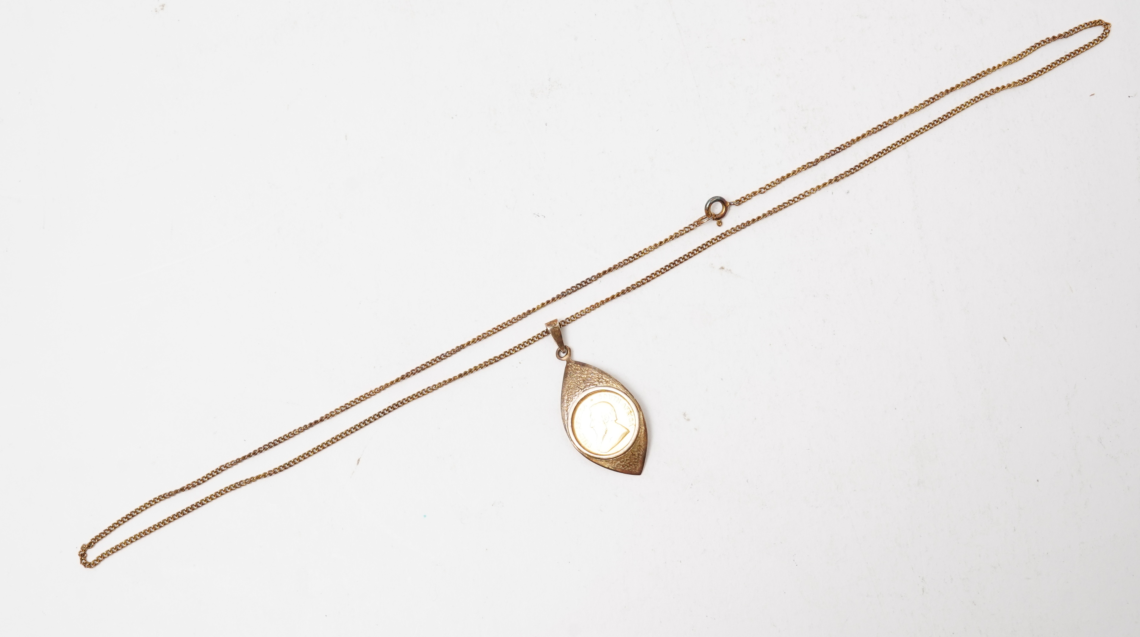 A gold 1/10 Krugerrand coin necklace, circa 1988 and later